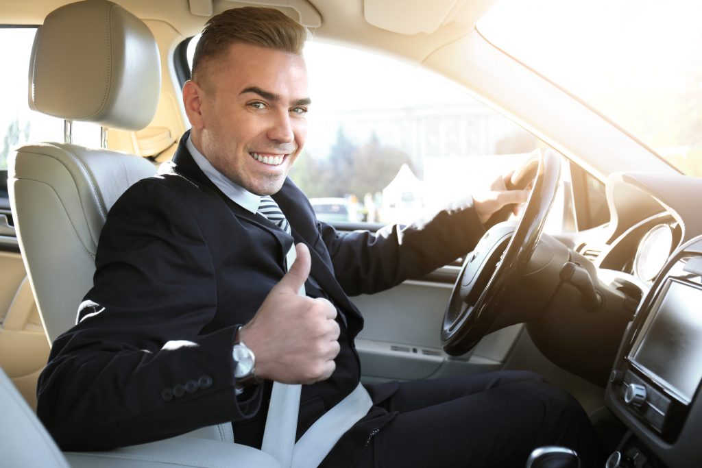 man happy after picking up new car from wedding car rental singapore